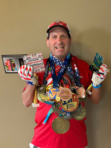 Neil Semmel with his Medals and Prices